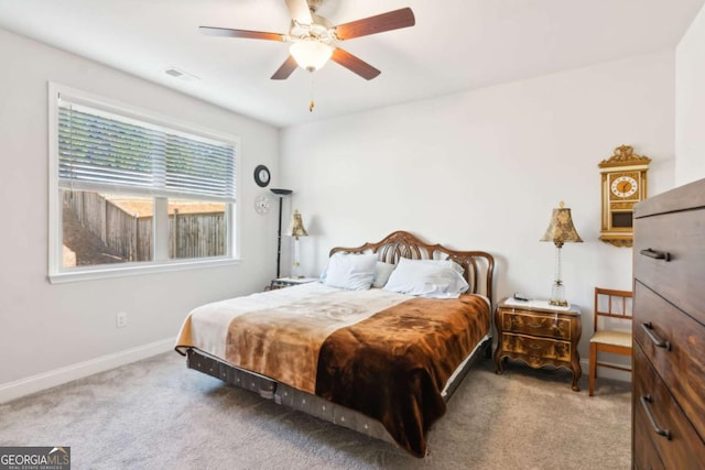 bedroom featuring ceiling fan and light colored carpet