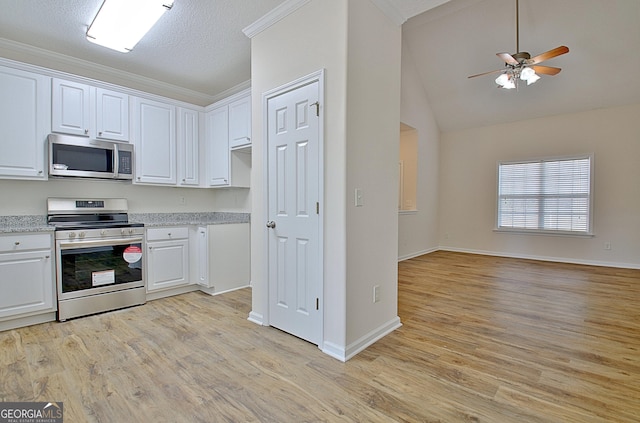 kitchen featuring white cabinets, ceiling fan, light hardwood / wood-style floors, and appliances with stainless steel finishes