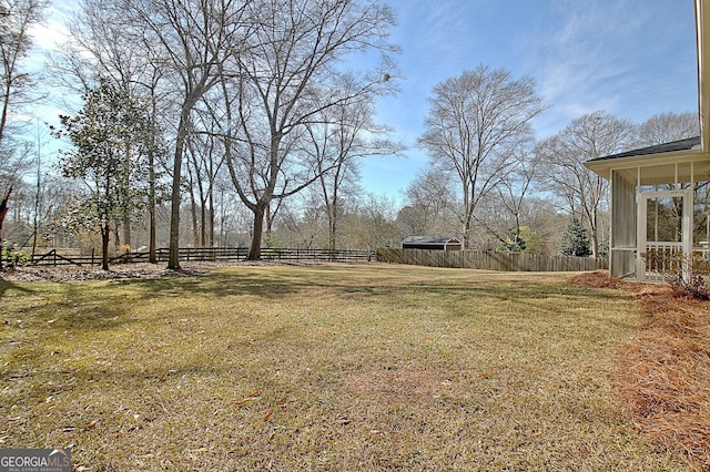 view of yard with a sunroom