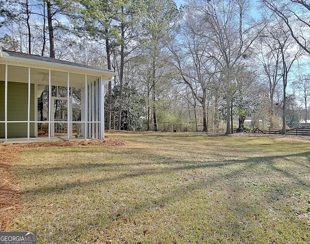 view of yard featuring a sunroom