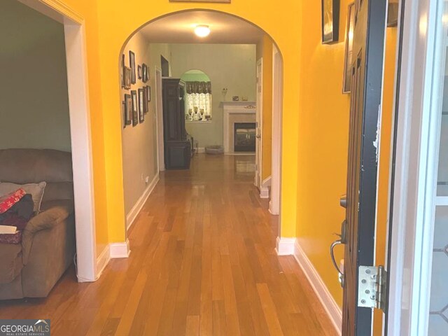 corridor featuring hardwood / wood-style floors