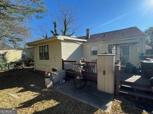 rear view of house with a deck