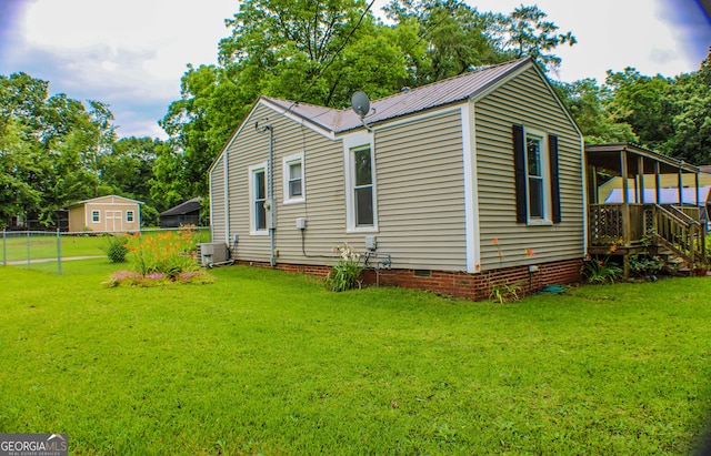 1812 Barnesville Hwy, Thomaston, GA 30286 - view of property exterior featuring crawl space, metal roof, central AC, and view of scattered trees