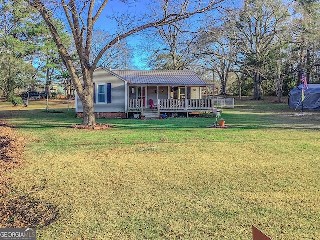 view of front facade with covered porch and a front lawn