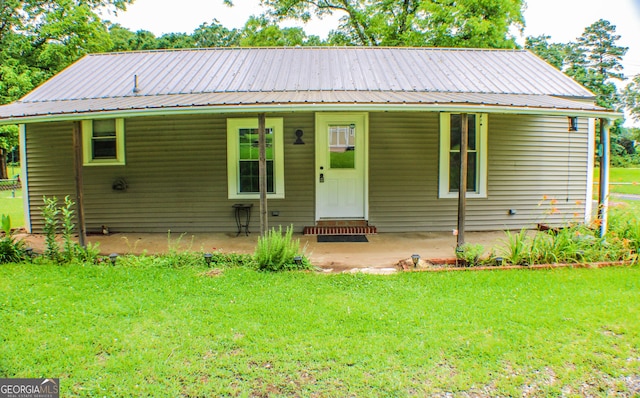 1812 Barnesville Hwy, Thomaston, GA 30286 - view of front of home featuring a front lawn, metal roof, and a porch