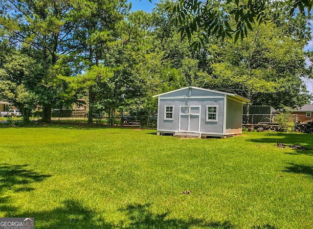 view of outdoor structure with a yard