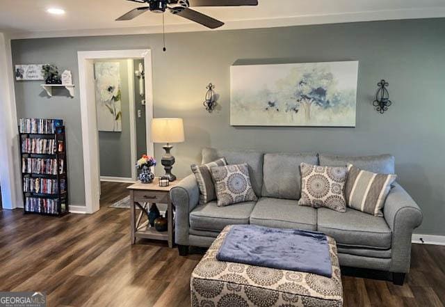 living room with dark hardwood / wood-style floors and ceiling fan