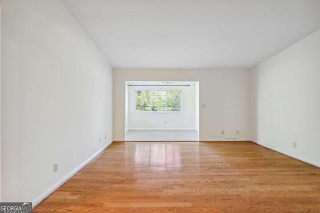 unfurnished room featuring light hardwood / wood-style floors