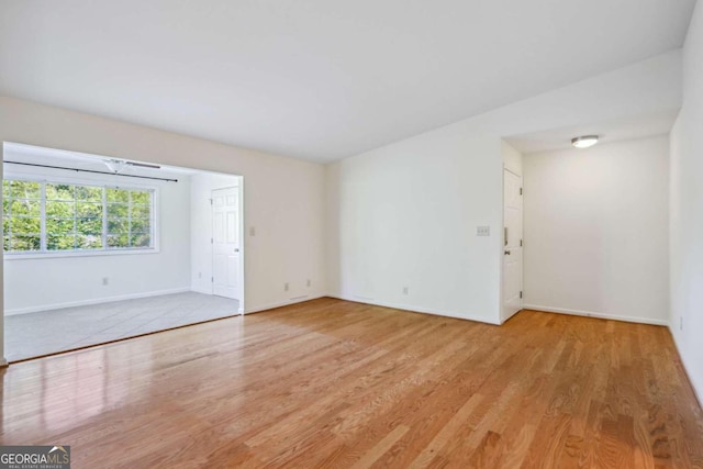 spare room featuring light wood-type flooring