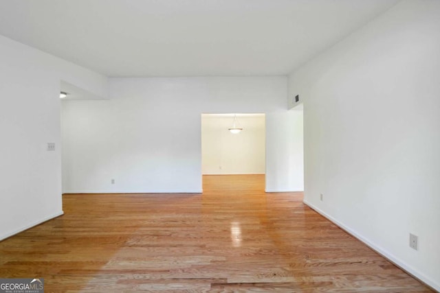 spare room with light wood-type flooring