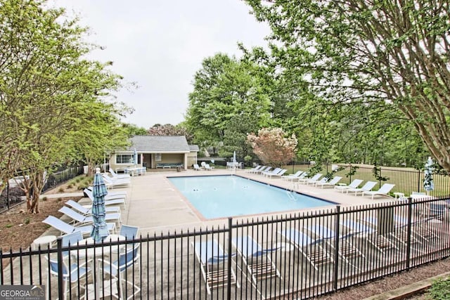 view of swimming pool with a patio