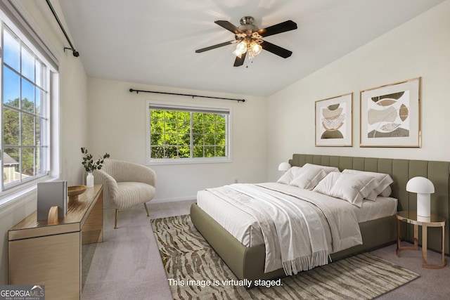 carpeted bedroom featuring ceiling fan