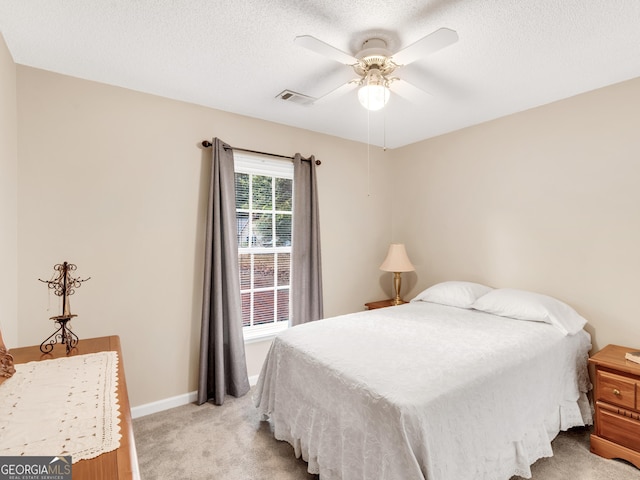 bedroom with ceiling fan and light colored carpet