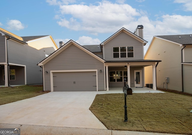 view of front of property with a garage, covered porch, and a front lawn