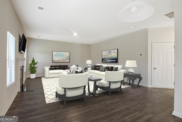 living room featuring dark hardwood / wood-style floors