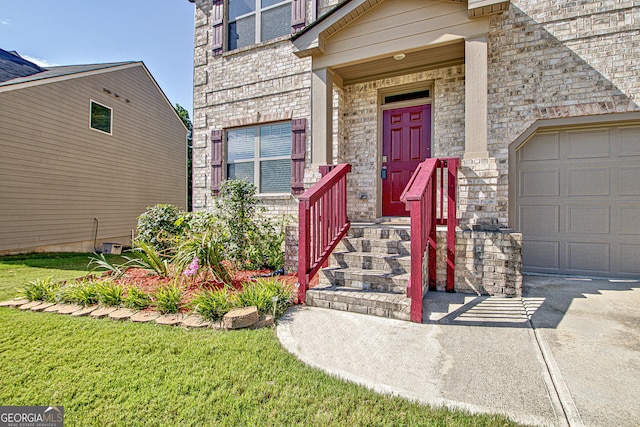 doorway to property with a garage