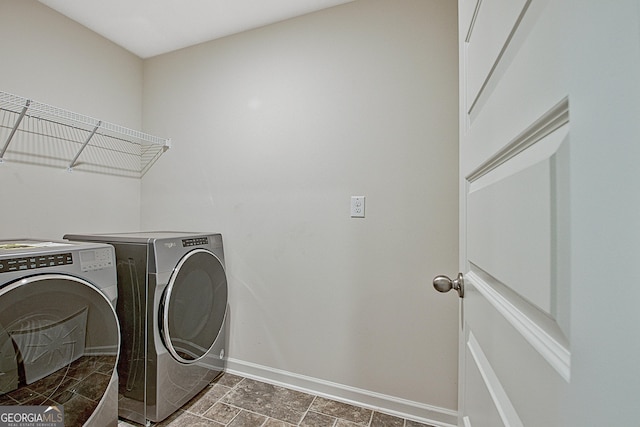 laundry room featuring washer and clothes dryer