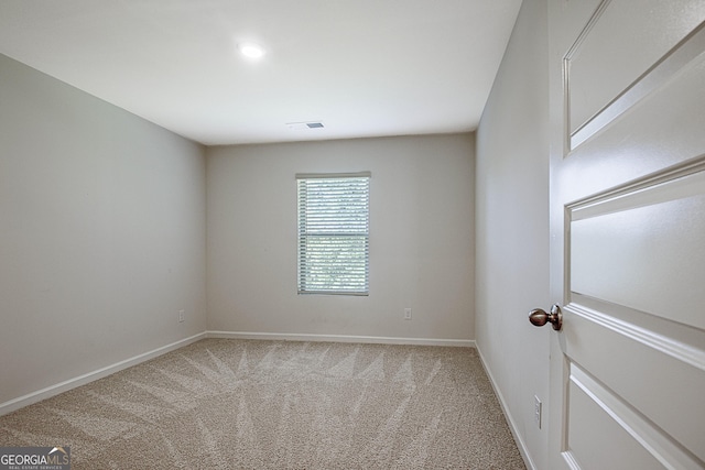 unfurnished room with carpet