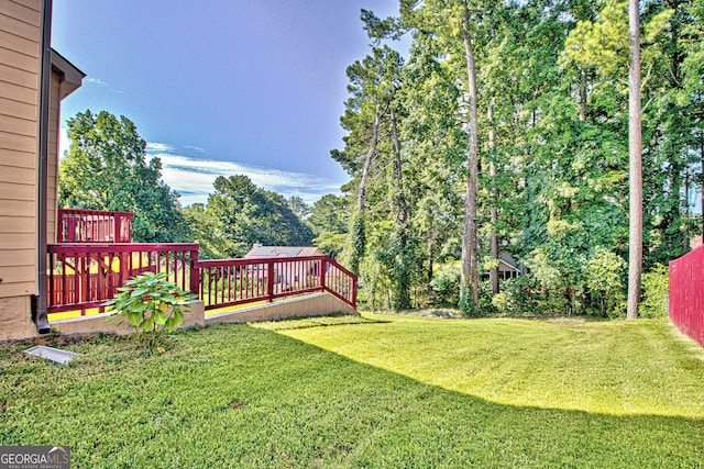 view of yard with a wooden deck