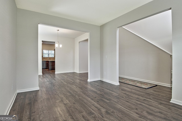 spare room featuring dark wood-type flooring