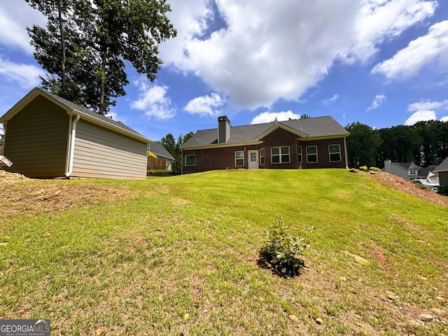 back of house featuring a yard