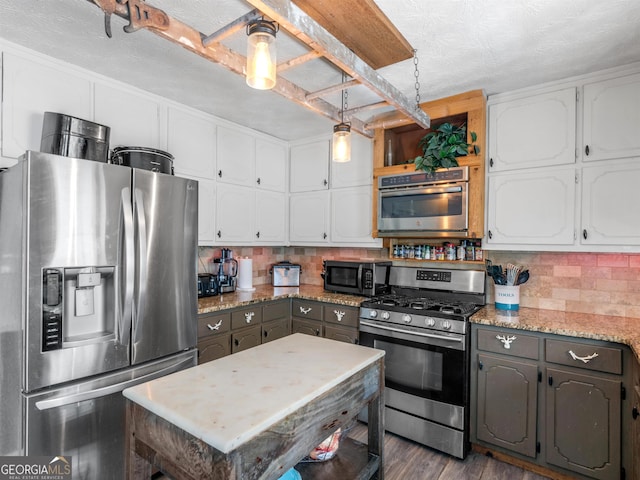 kitchen featuring decorative backsplash, dark wood-style floors, stainless steel appliances, white cabinetry, and open shelves