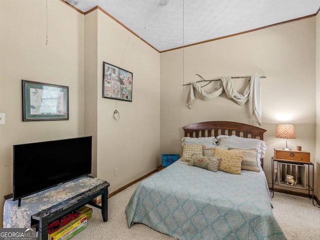 bedroom featuring baseboards, carpet flooring, and crown molding