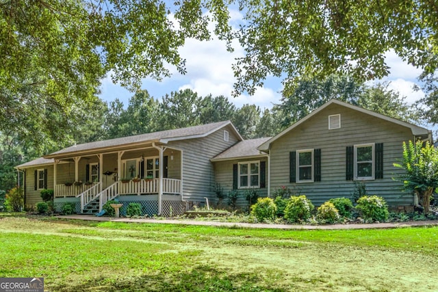 ranch-style home with a porch and a front lawn