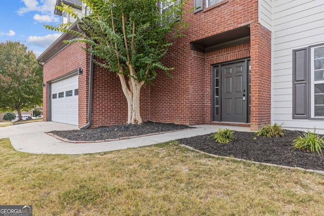 doorway to property with a yard