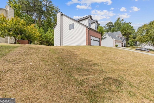 view of property exterior with a yard and a garage