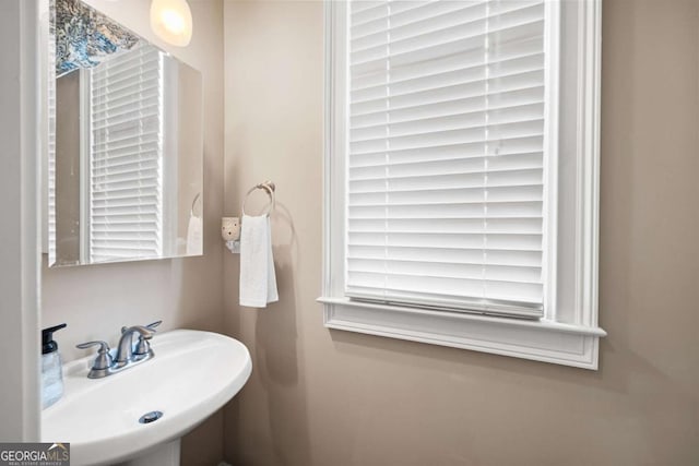 bathroom featuring sink and a wealth of natural light