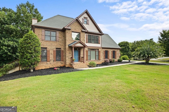 craftsman house featuring a front yard