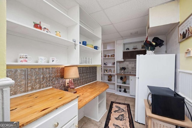 home office featuring a paneled ceiling