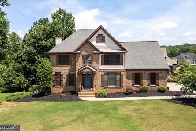 view of front of property with a front lawn