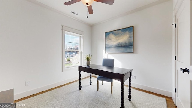 office area with ceiling fan, ornamental molding, and light hardwood / wood-style flooring