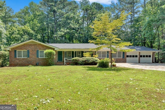 single story home featuring a front lawn and a garage