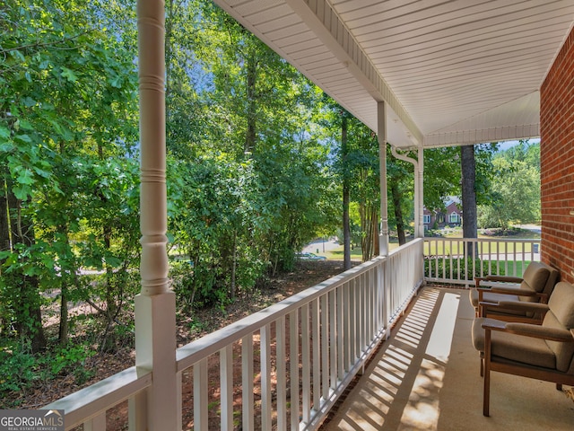 balcony featuring a porch