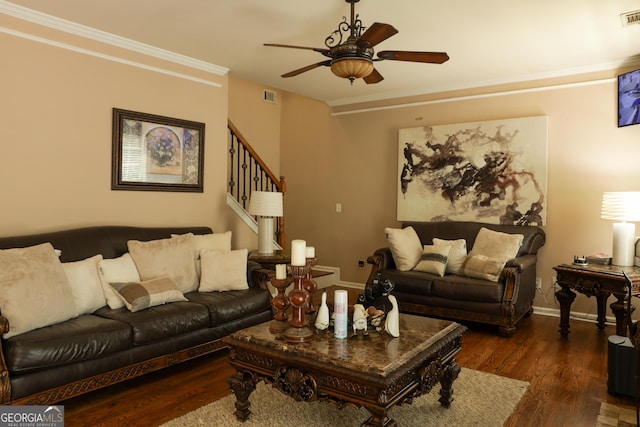 living room featuring ceiling fan, dark hardwood / wood-style flooring, and ornamental molding