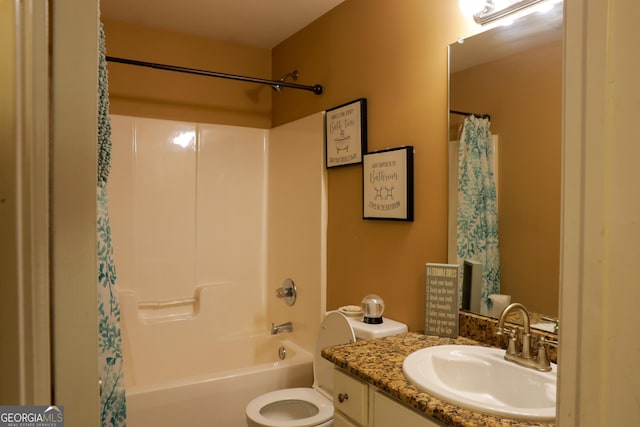 full bathroom with vanity, shower / tub combo, and toilet