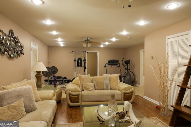 living room with hardwood / wood-style flooring and ceiling fan