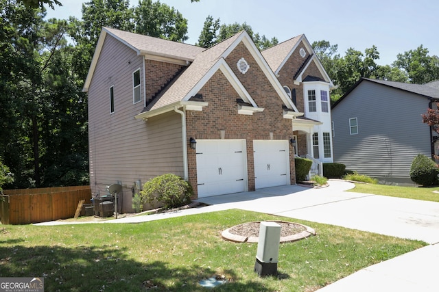 view of front facade featuring a garage and a front yard