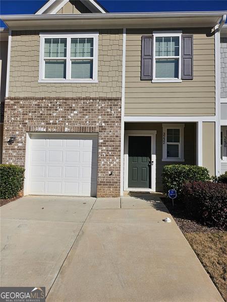 view of front of property with a garage