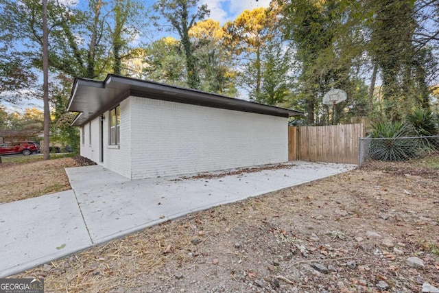 view of side of property with a patio