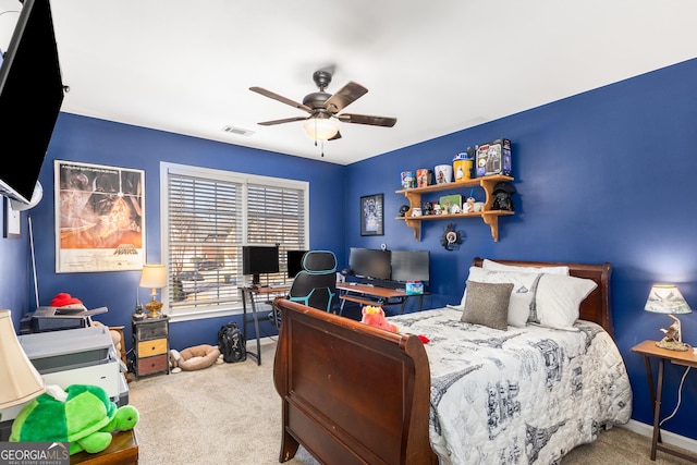 bedroom featuring ceiling fan and light carpet