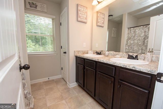 bathroom featuring vanity and a healthy amount of sunlight