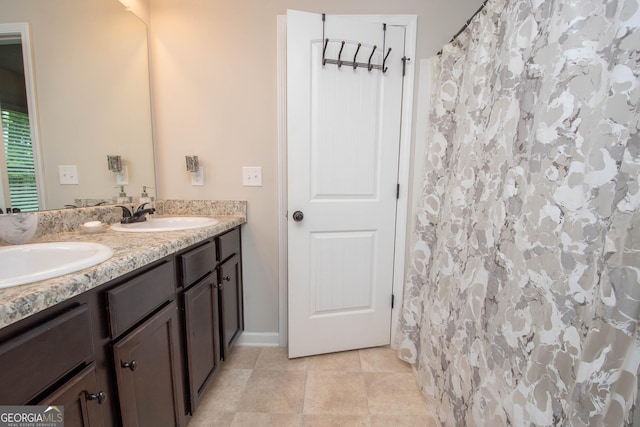 bathroom with a shower with curtain and vanity