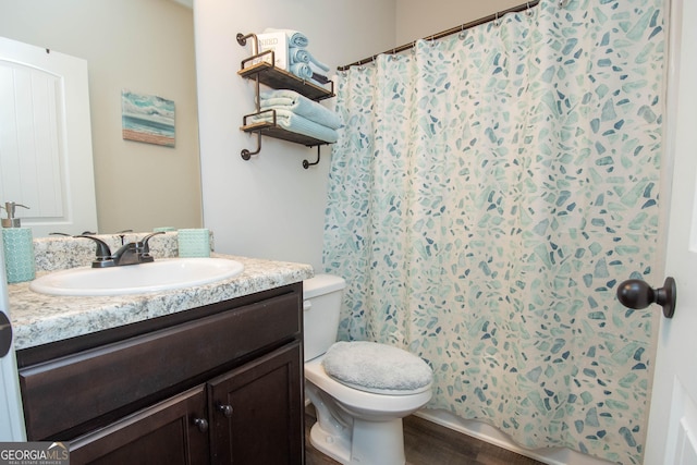 bathroom featuring hardwood / wood-style floors, vanity, and toilet