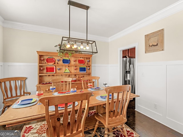 dining area with dark hardwood / wood-style floors and ornamental molding