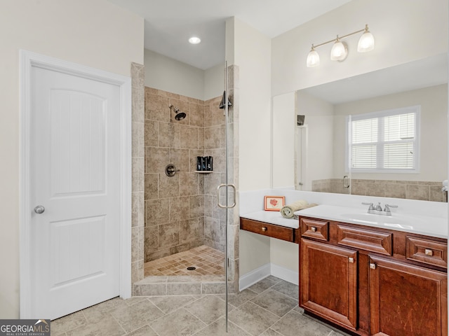 bathroom featuring vanity and an enclosed shower