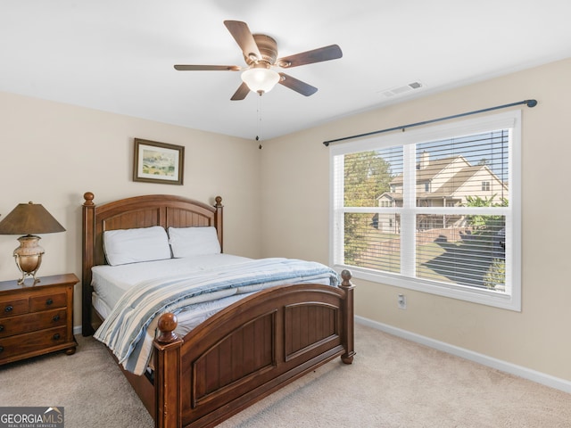 bedroom featuring ceiling fan and light carpet